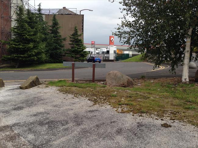 Cross the road and head right of the Renault sign. 