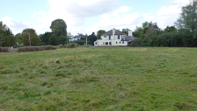 View across Harlow Common towards White Horse public house