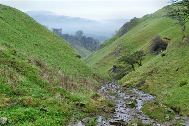 Peveril Castle comes into view down Cave Dale