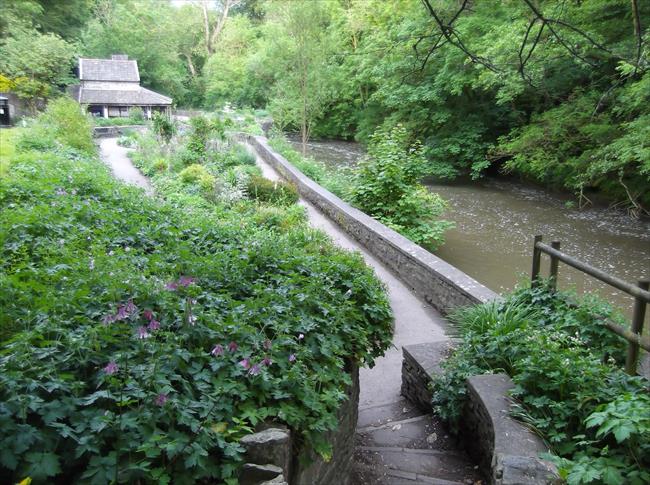 Panoramic view of Snuff Mills garden area, River Frome &amp; "Mill" building in background.